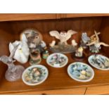 Collection of owl and bird figures and plates