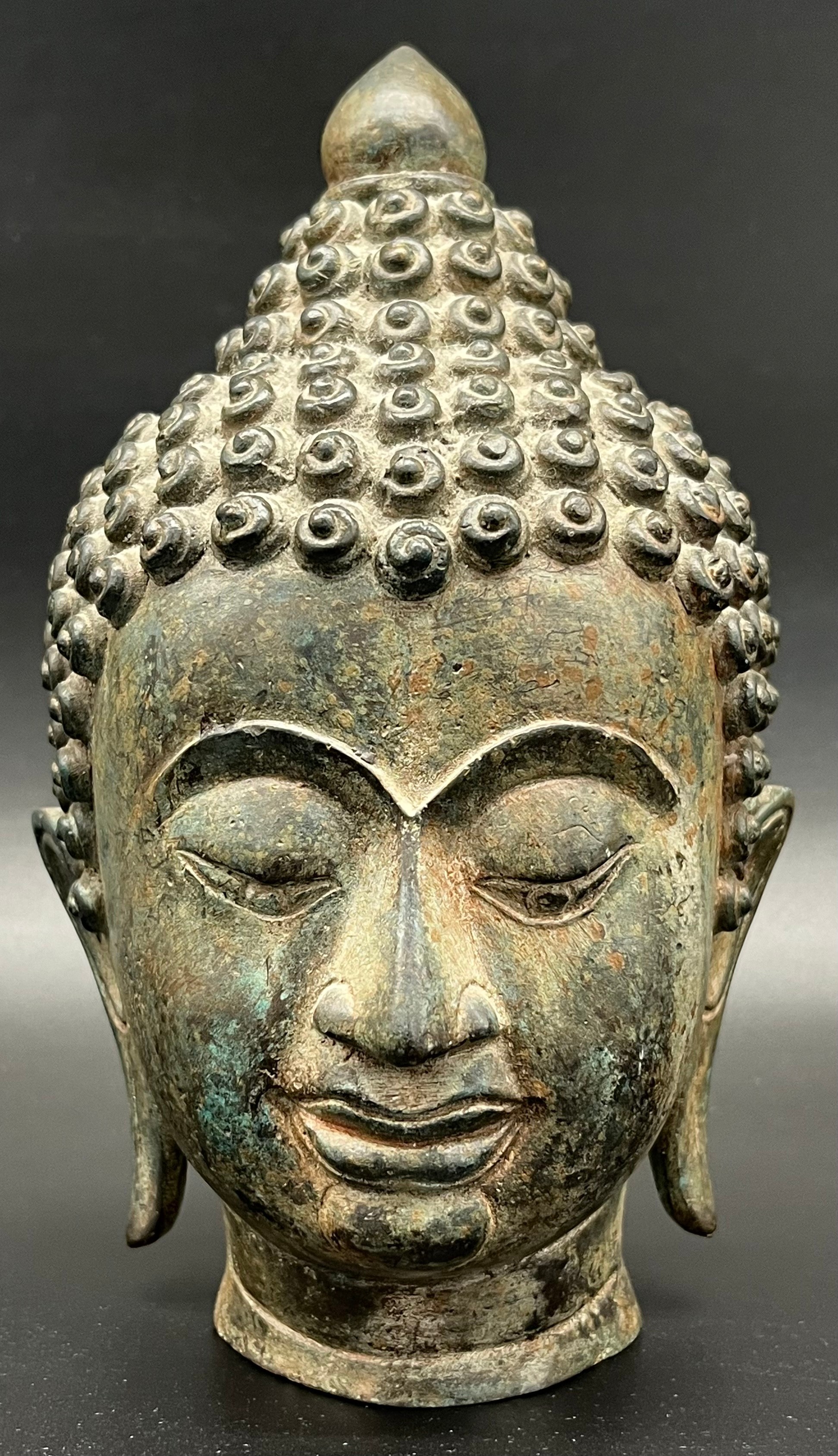 Antique Chinese Monumental Bronze head of Buddha Shakyamuni. Beautiful patina and detail showing.