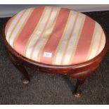 Antique stool, the oval shaped upholstered seat, raised on cabriole legs ending in pad feet. [48cm