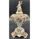 Antique Royal Vienna mantel piece urn with lid. Highly decorated with raised relief flowers, Lid has