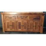Contemporary rustic country house sideboard, the rectangular top above three short drawers and three