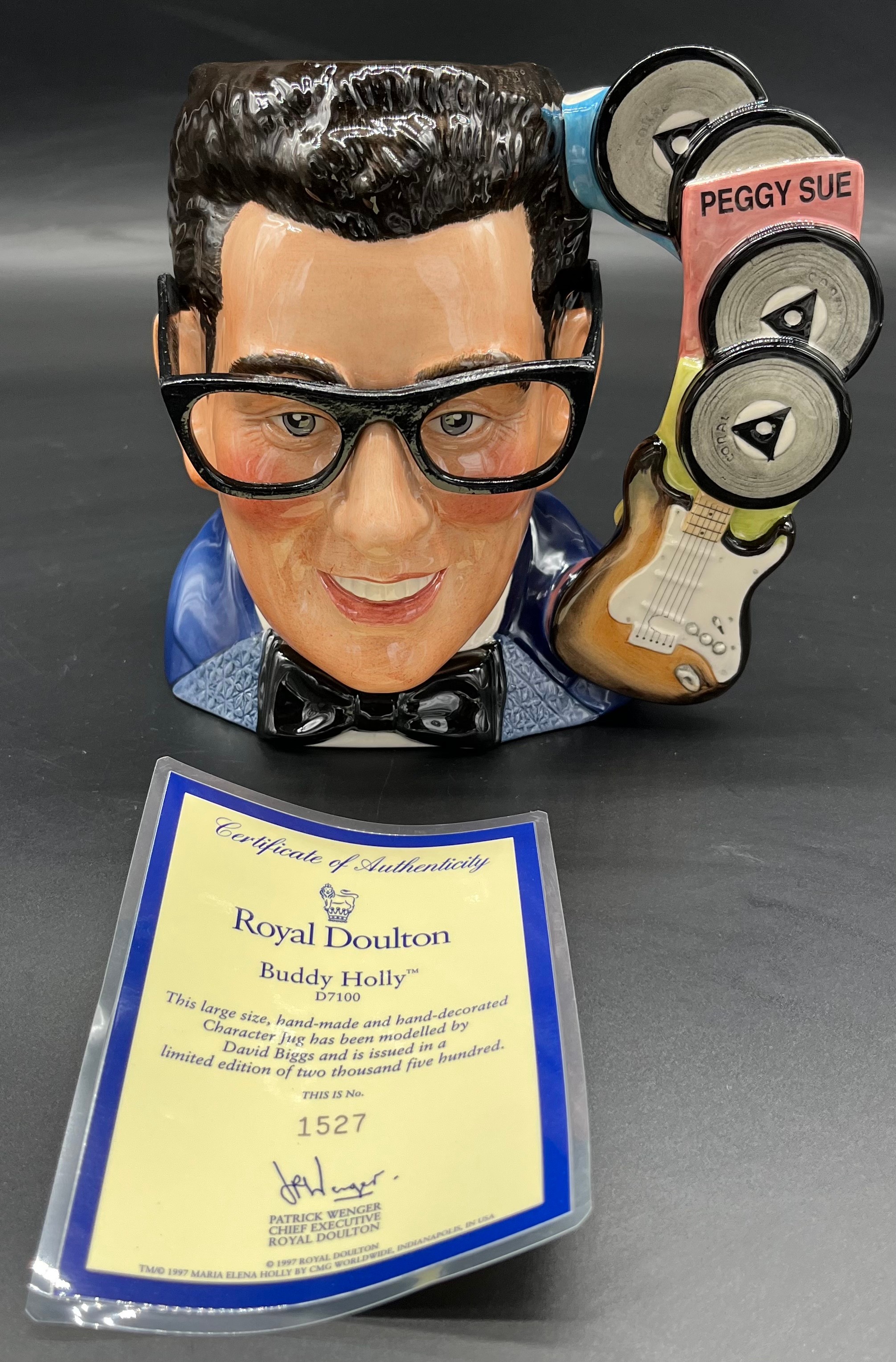 Large Royal Doulton 'Buddy Holly' D7100 Character toby jug with certificate. Ltd edition 1527/2500.