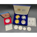 A Boxed Royal Mint Sterling silver crown, Boxed 'The Tower Mint' four piece coin set and four