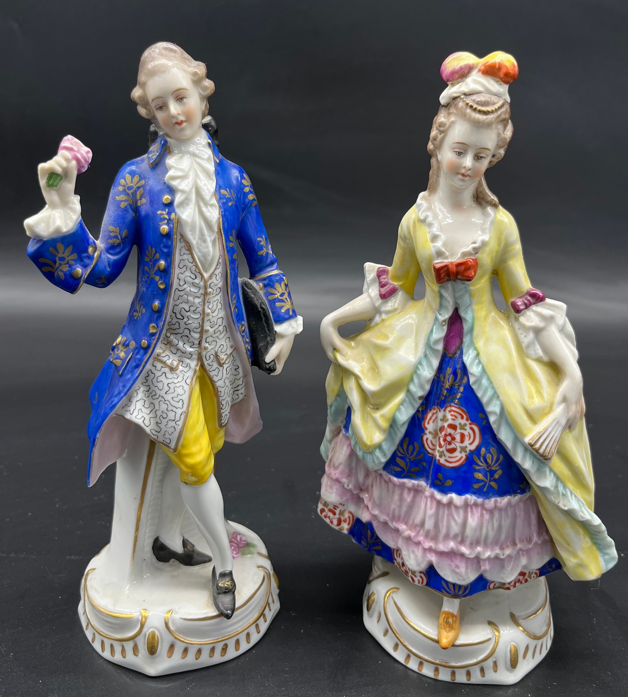 Two 19th century Chelsea pottery gentleman and lady figurine. [19cm high]