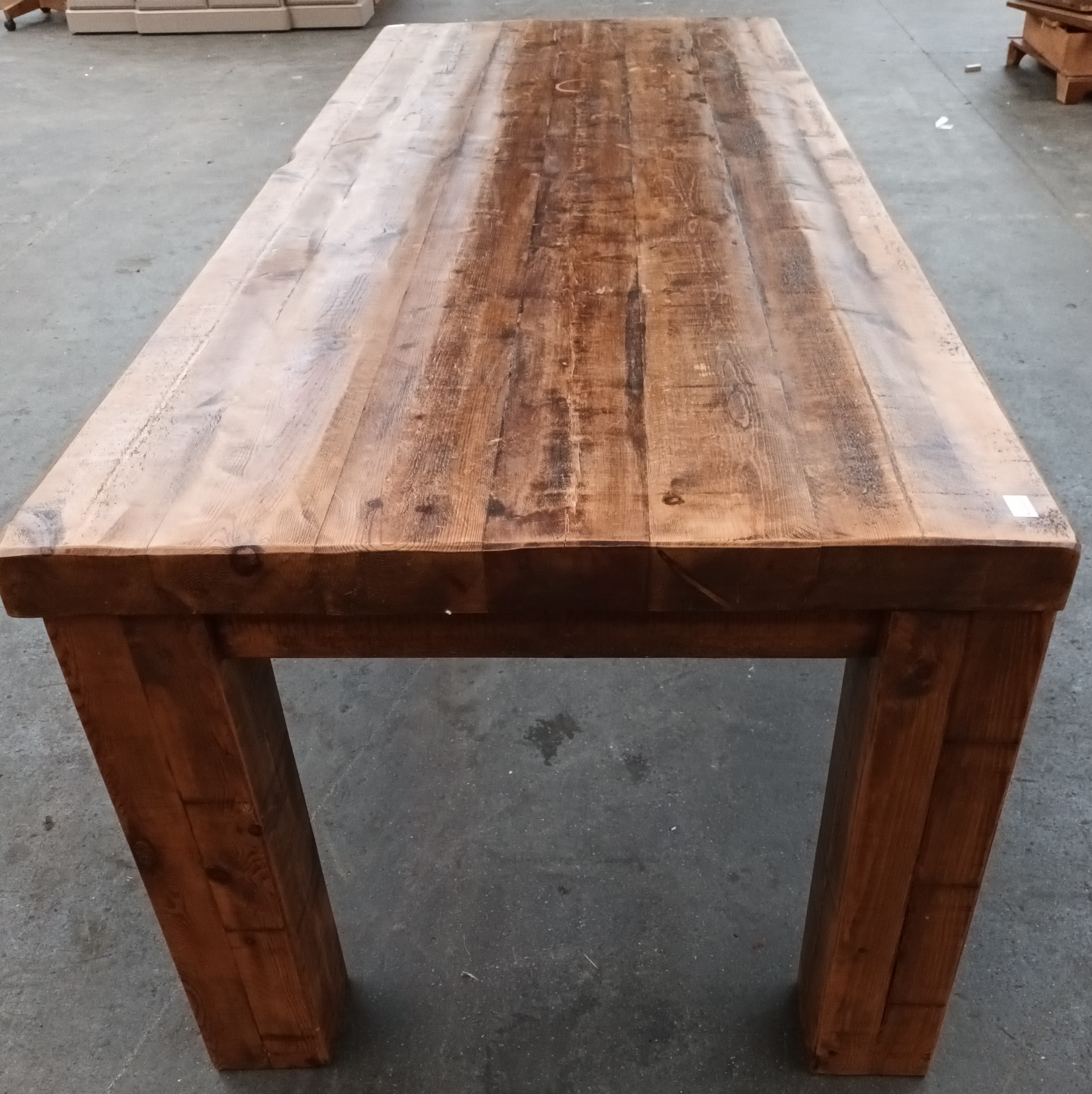 Solid rustic wood dining table, the long rectangular surface raised on square block legs [ - Image 4 of 5