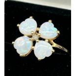 10ct yellow gold and opal stone ring. Heart shaped opals. Set with a single diamond to the