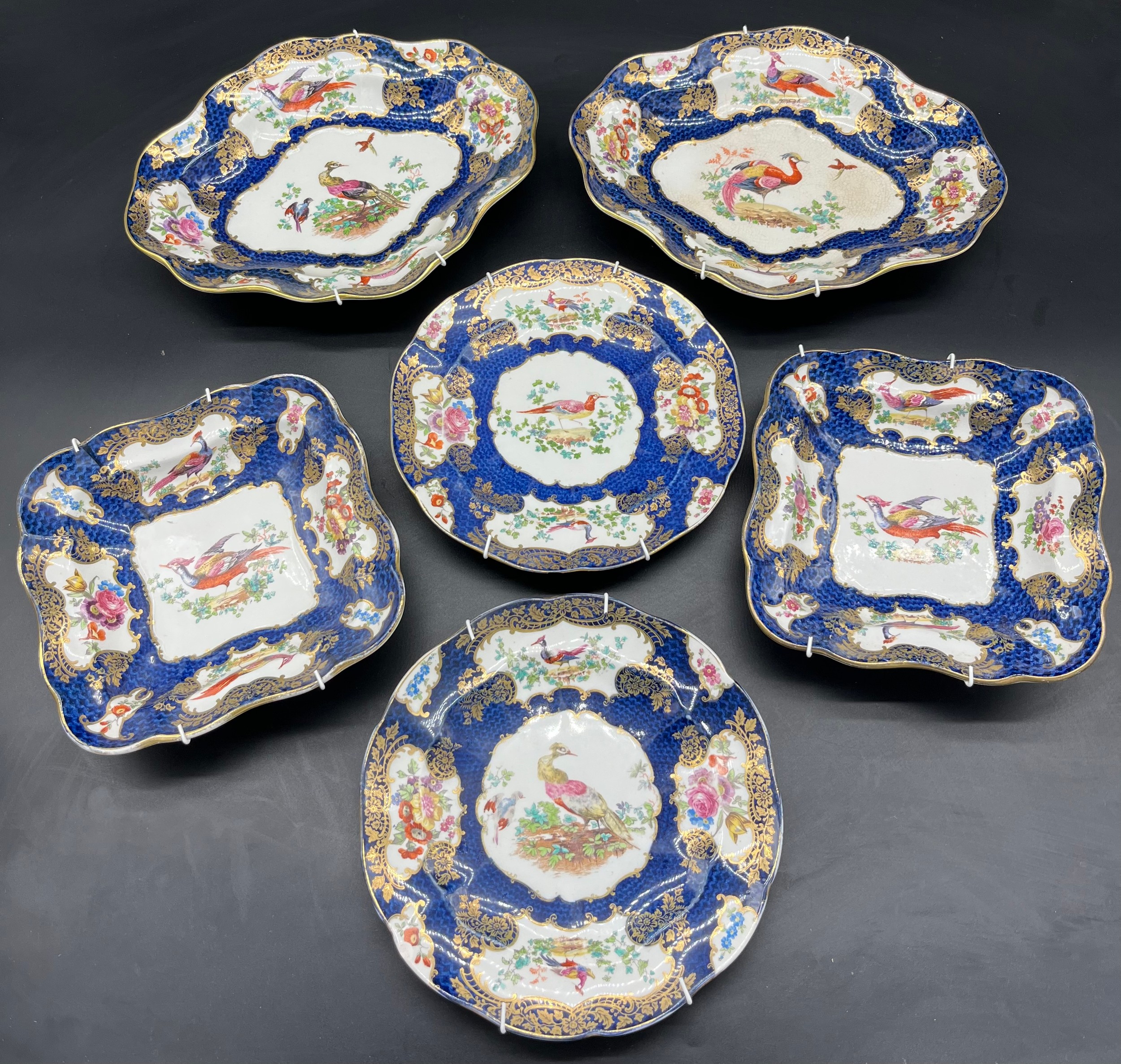 A selection of 19th century Birds of Paradise design wall hanging plates/ cabinet plates and bowls.
