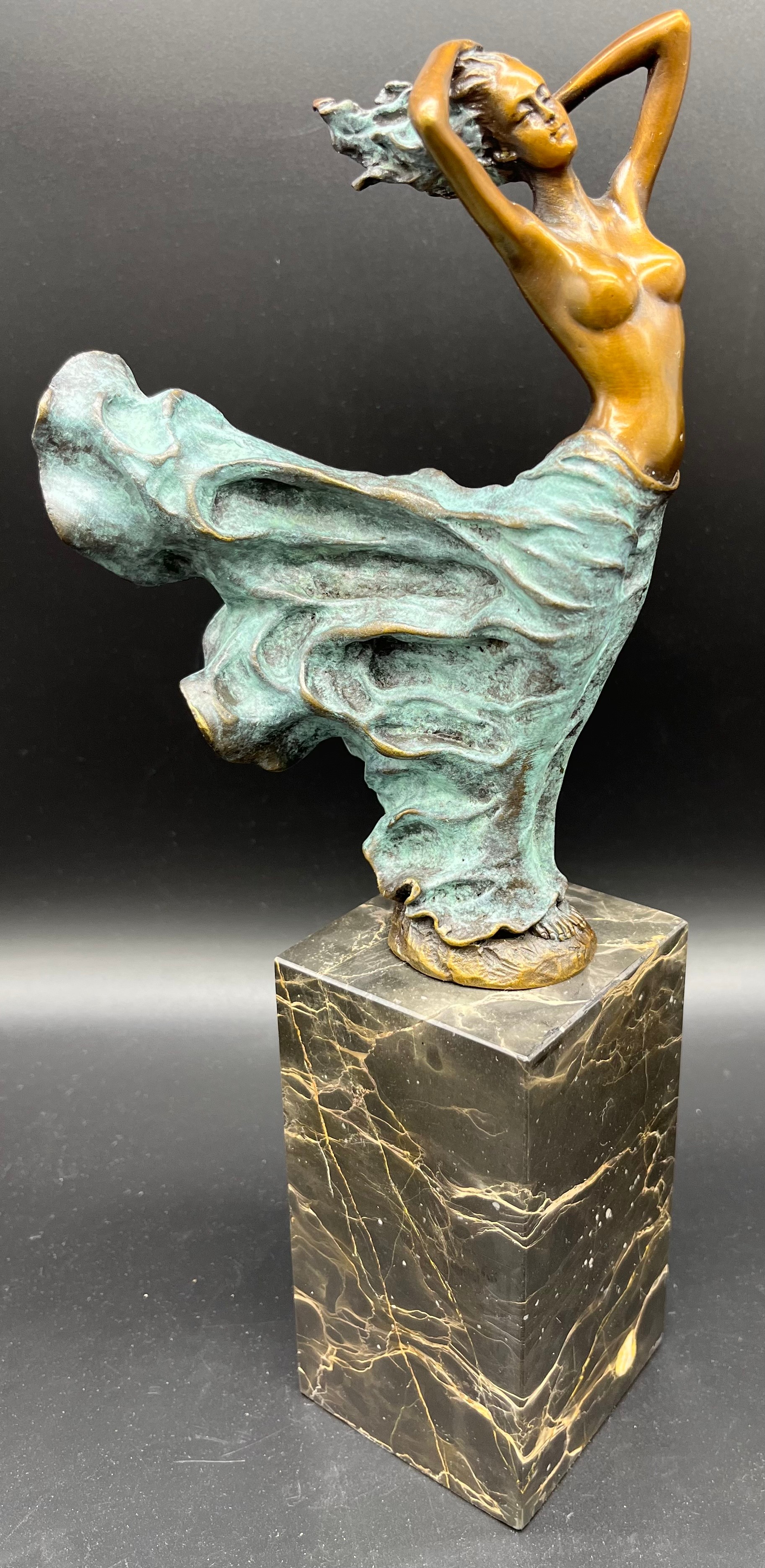 A Bronze statue of a Serene Art Nouveau nude lady figurine, mounted on a veined Marble base.