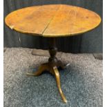18th/19th century snap top table, the circular top raised on a tripod base [64cm high, 64cm in