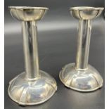 A Pair of Liberty style arts and crafts Birmingham silver candle sticks. Produced by William