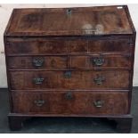 Early 18th century walnut veneer writing bureau, the drop downslope opening to interior storage