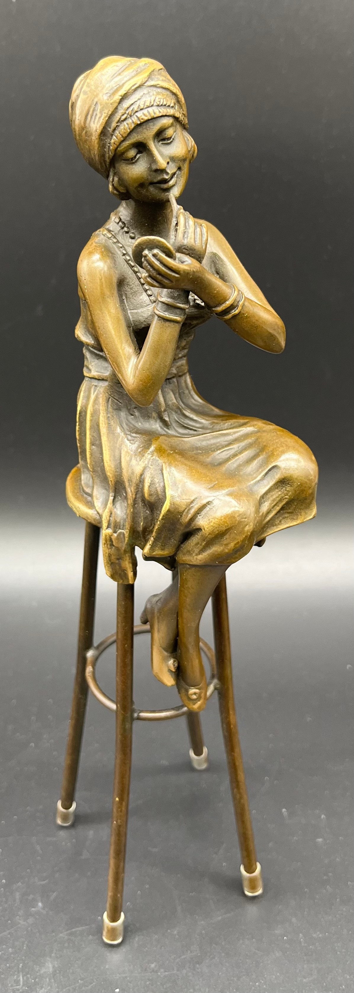 Bronze Statue of an Art Nouveau lady seated on a stool, Signed D.H. Chiparus. [27cm high]