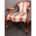 Victorian bedroom armchair, the shaped back above open arm carved scroll supports and a cushioned