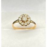 Antique 18ct yellow gold [Unmarked] diamond set ring. Centre diamond surrounded by 10 diamonds. [