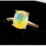 10ct yellow gold ladies ring set with a large opalescent style stone. [Ring size P] [1.98Grams]