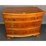 20th century yew wood chest of drawers, the rectangular top with bow front above a pull-out ledge