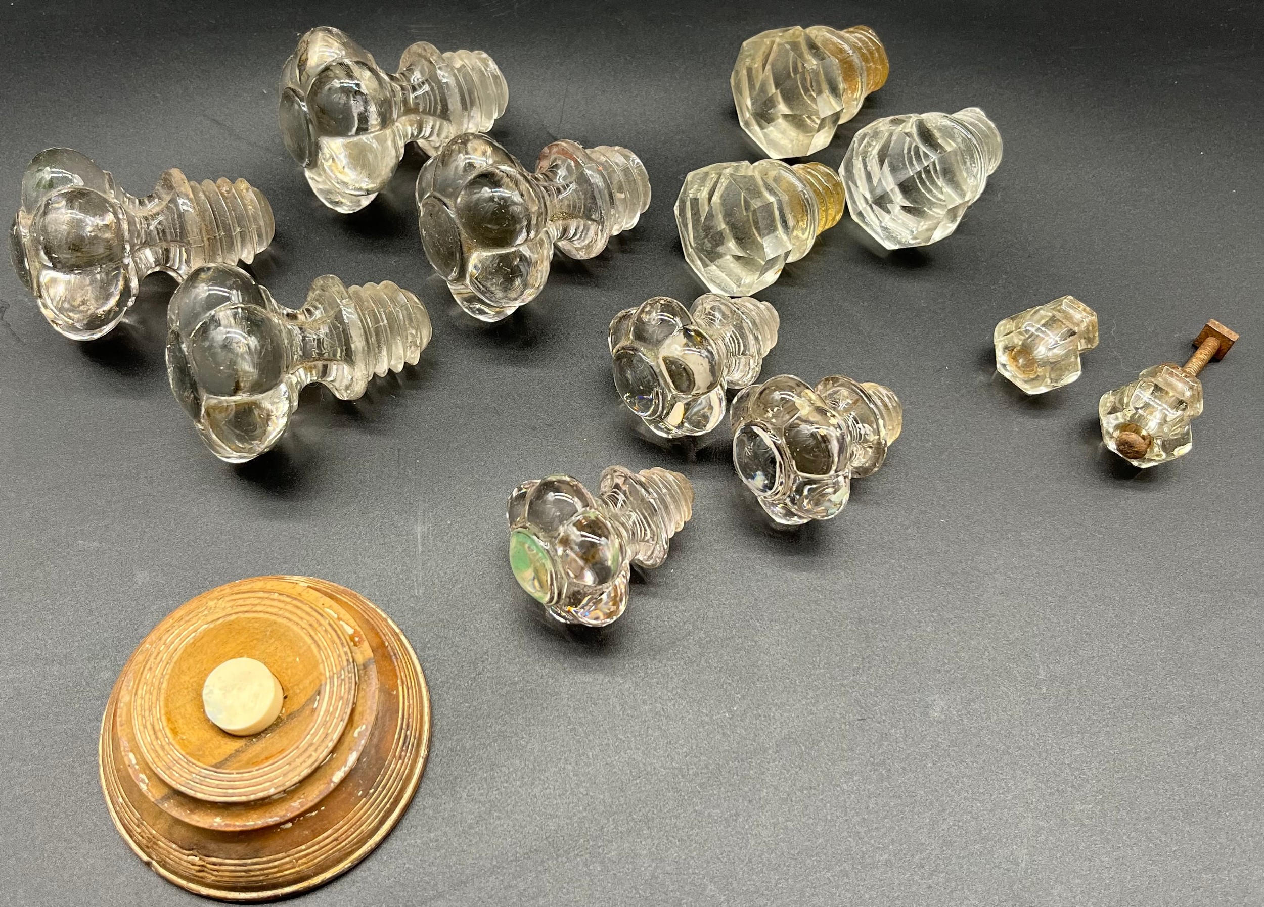 A Quantity of antique pressed glass handles and wooden push buzzer.