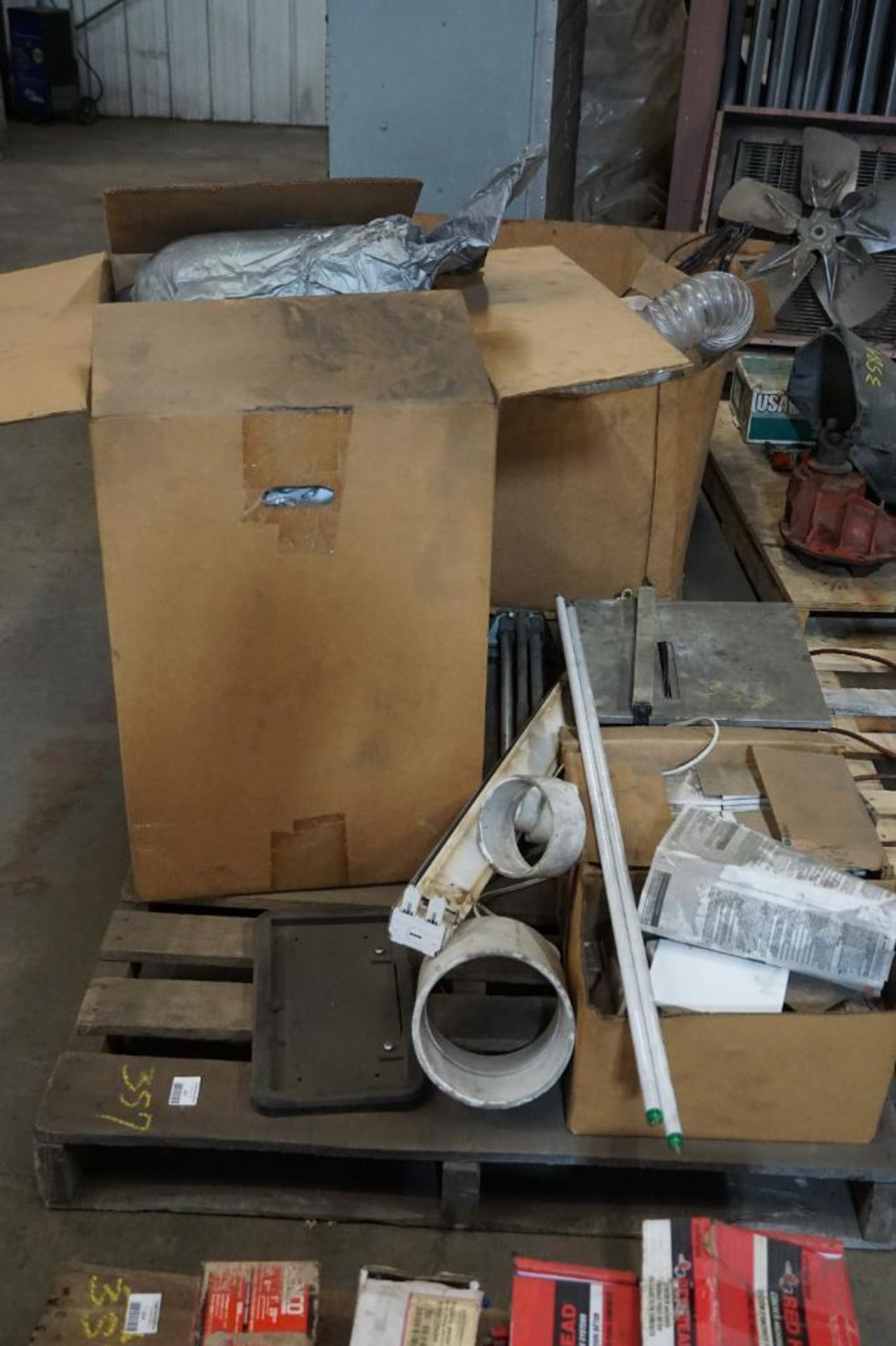 Pallet of Toilet and Light Bulbs, Tiles, and Tile Saw