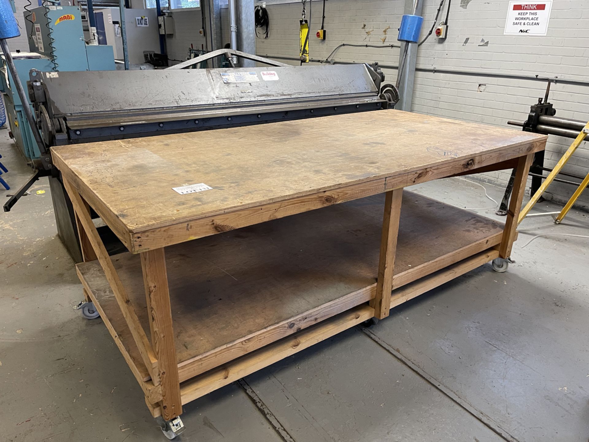 Mobile Wooden Work Bench. 4' x 8' x 37" High.