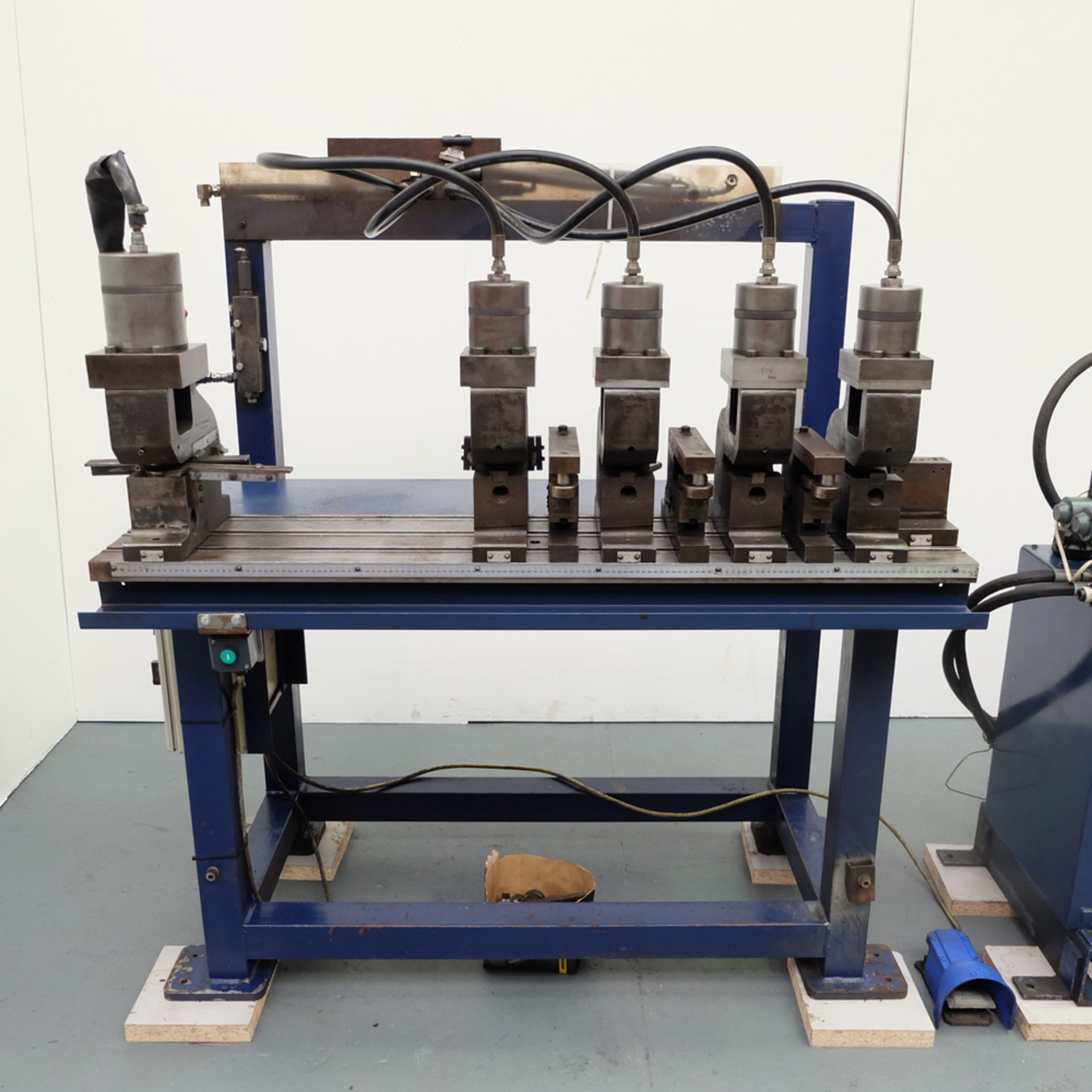 Hydraulic Powered 5 Head Punching Station. On Tee Slotted Table.