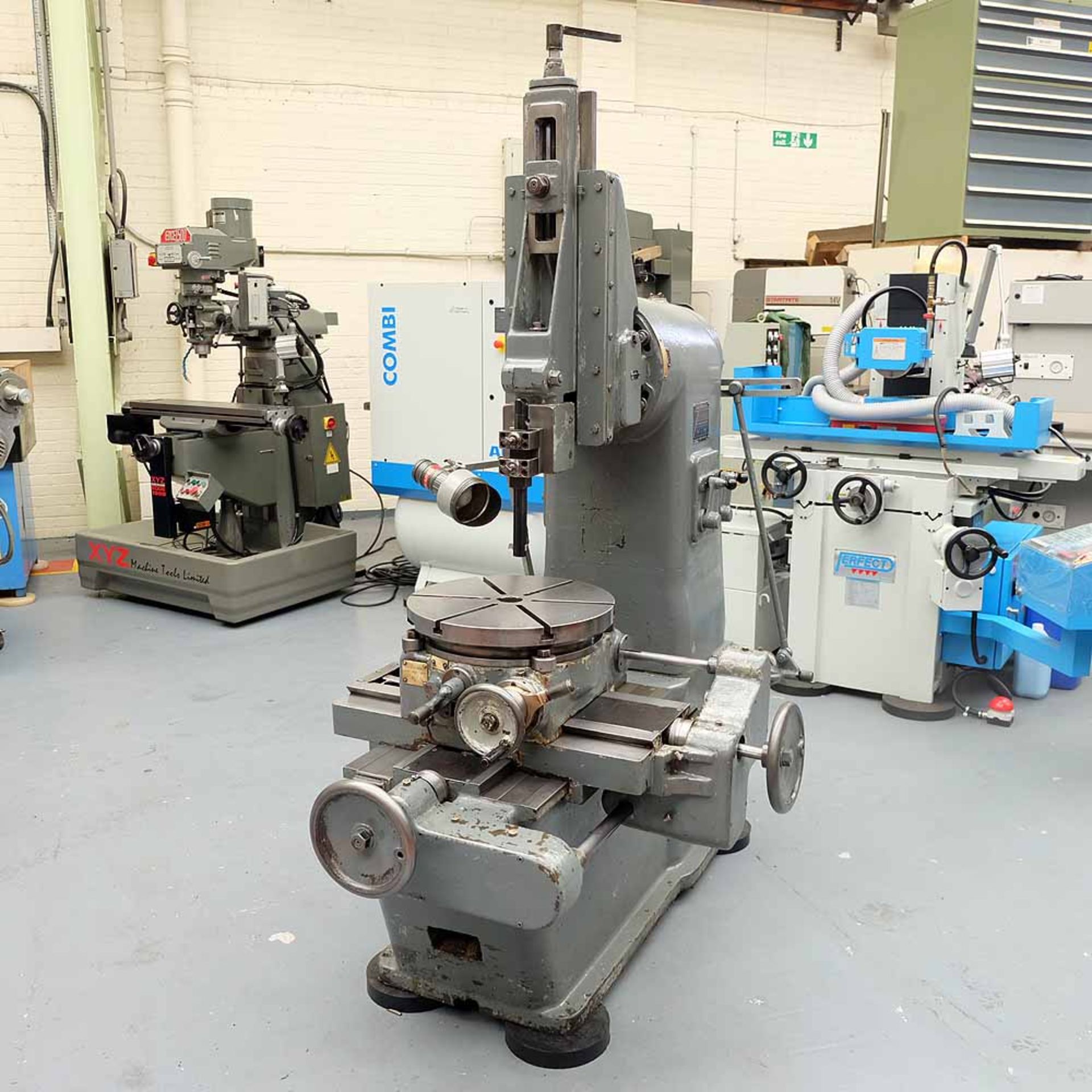 Burdett 6" Slotting Machine with Indexing Rotating Table. Table Size: 18" Diameter.