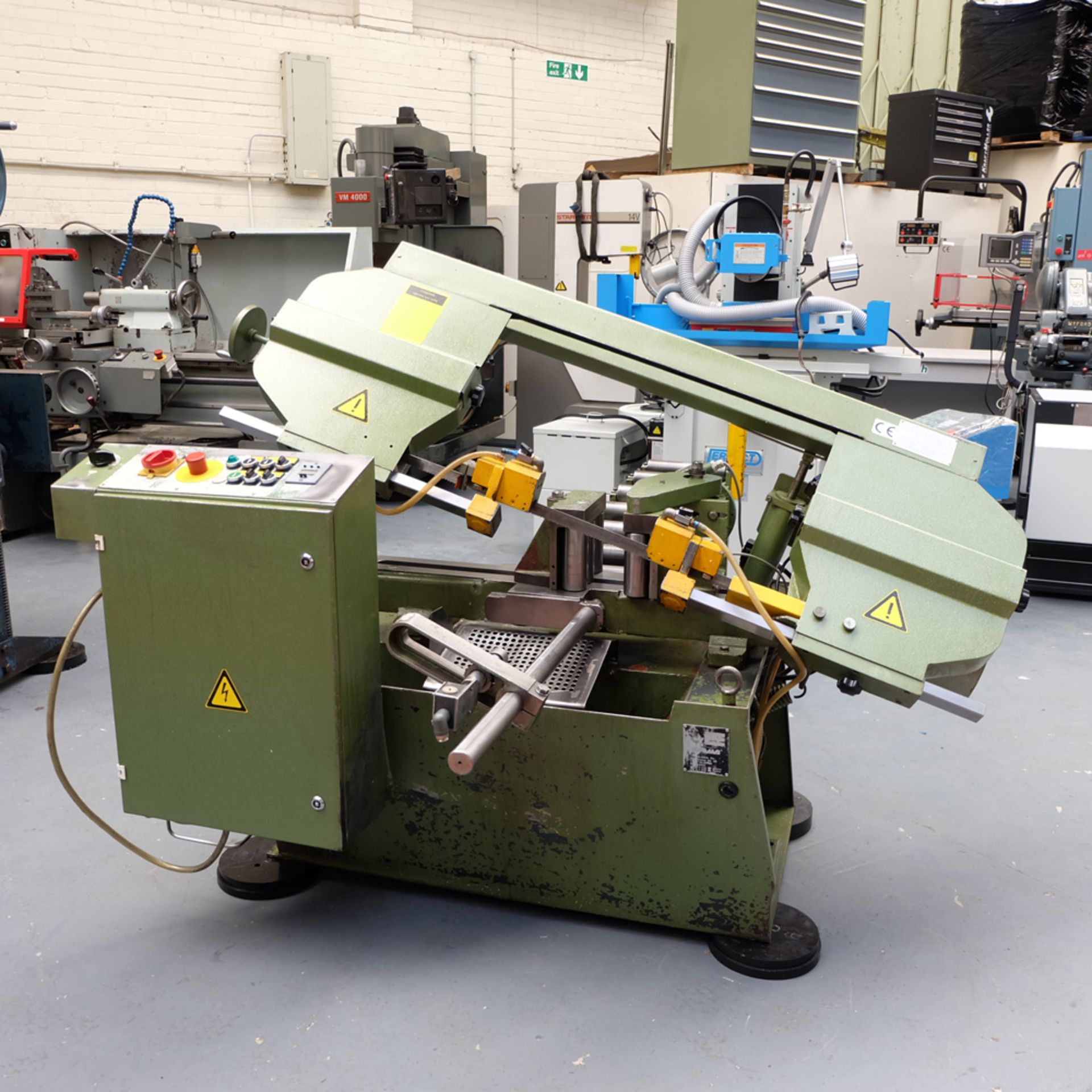 Siloma Model OL261 Automatic Feed Bandsaw. Capacity 10" Round. Powered Roller Type Vice.