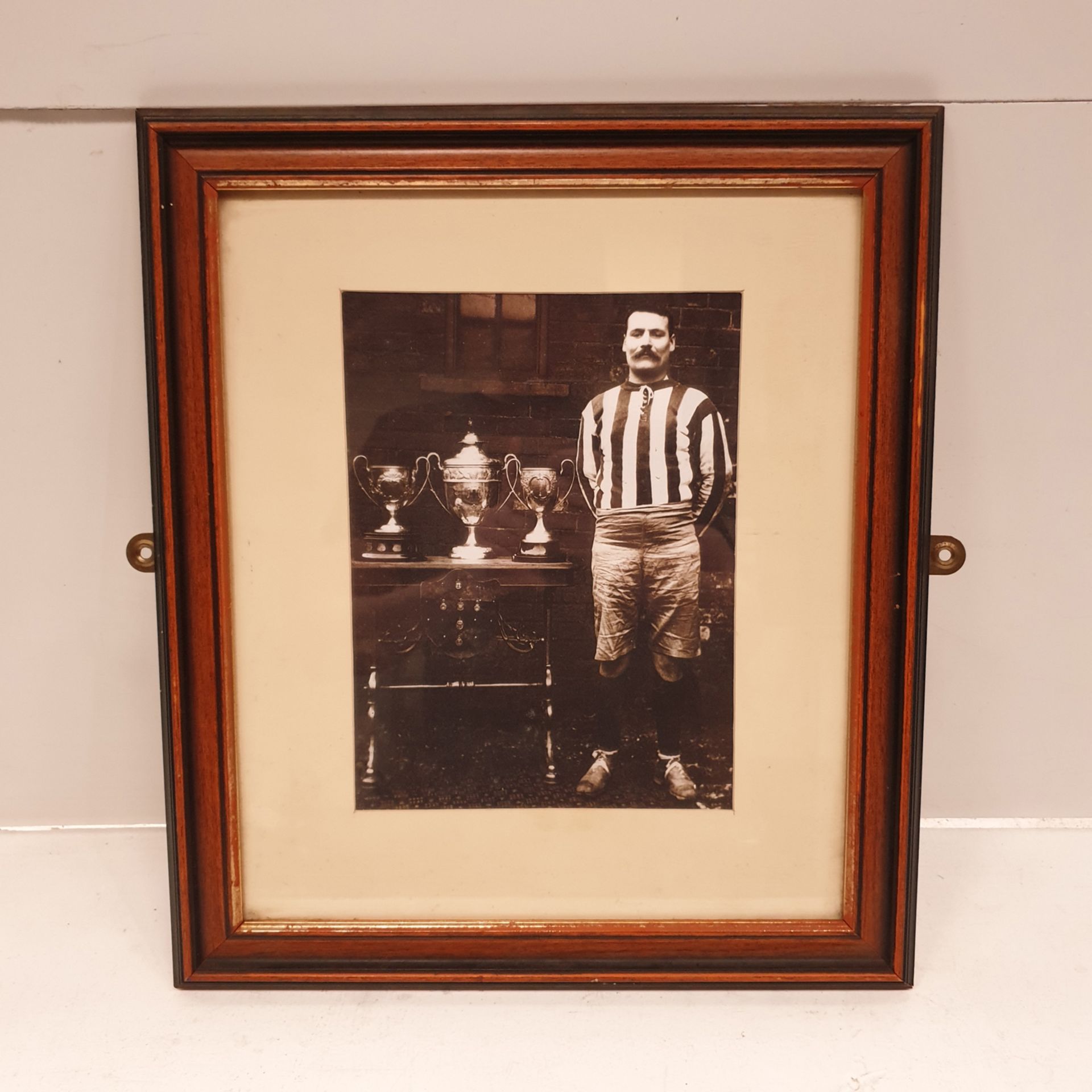 Football Trophies Framed Picture. Approx Dimensions 14 1/4" x 16 1/2".