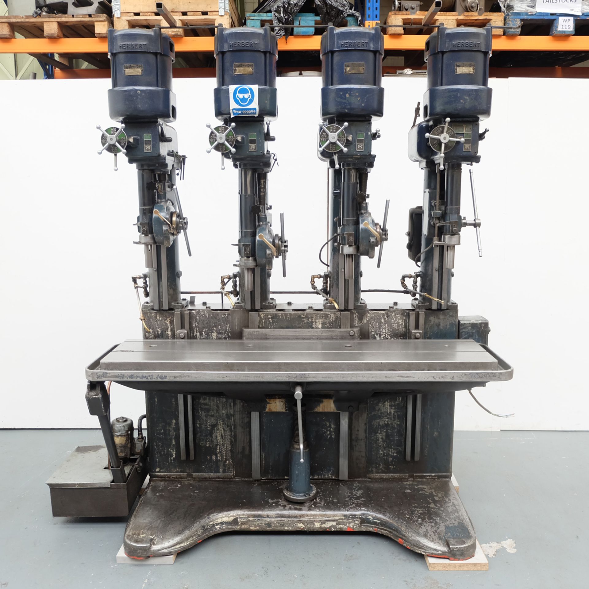 Herbert 4 Spindle Drilling Machine. Table Size 68" x 15 1/2". Throat 7 1/2".