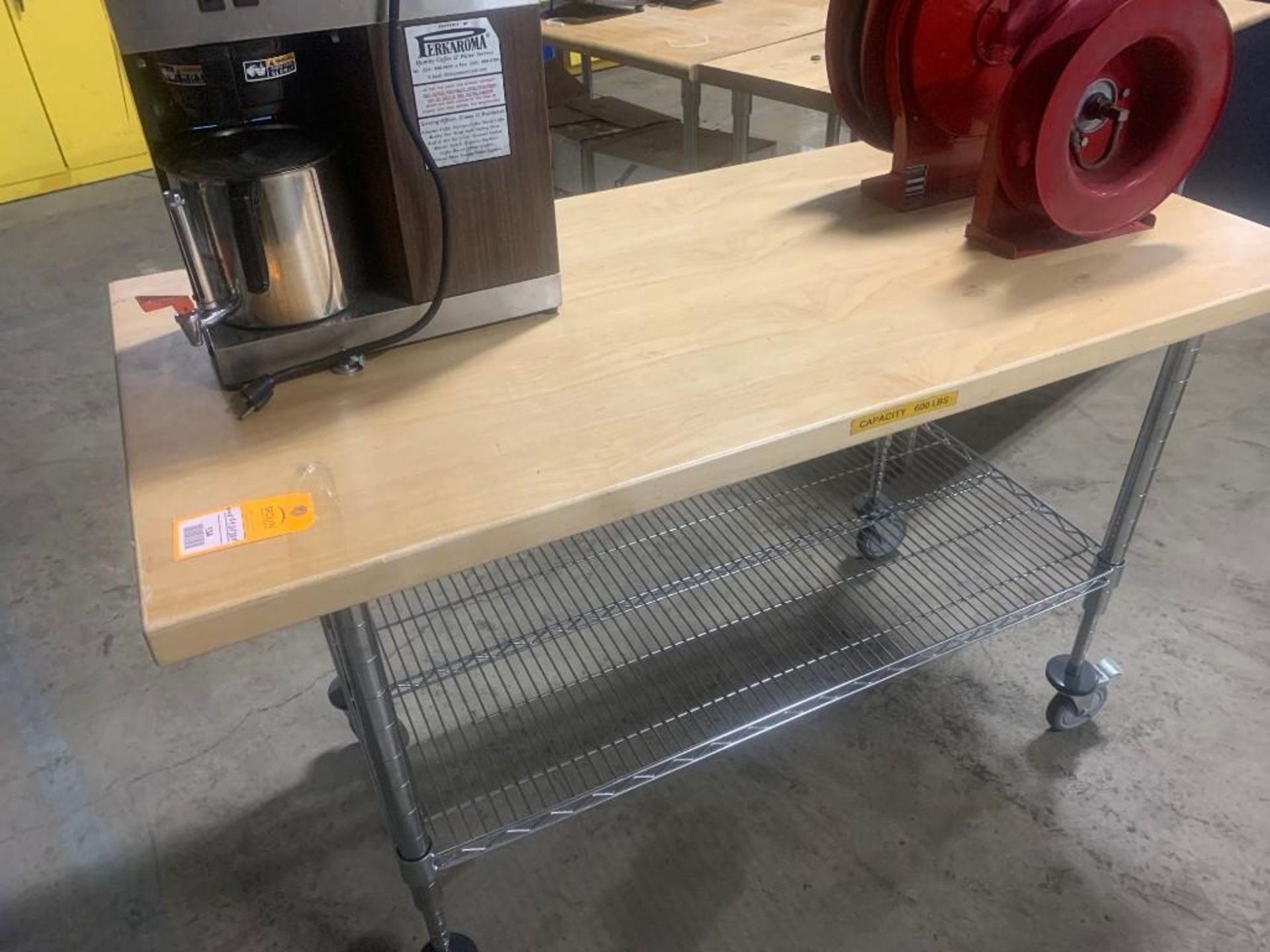 Butcher block top rolling work bench. 59"w x 30"d x 38"t.