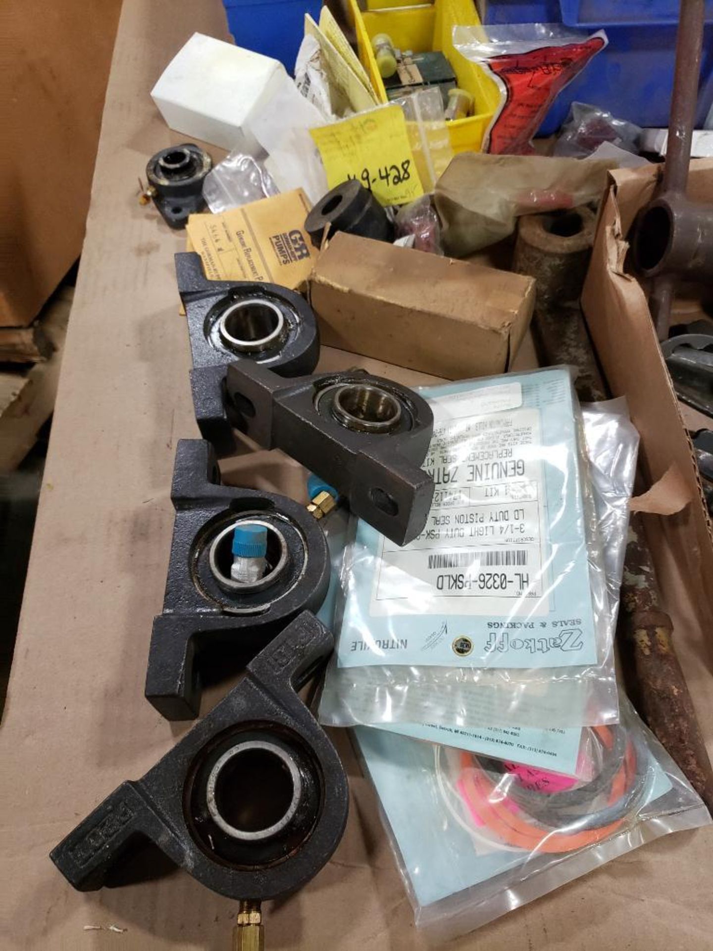 Pallet of assorted replacement parts. Bearings, wrenches hoses. - Image 2 of 10