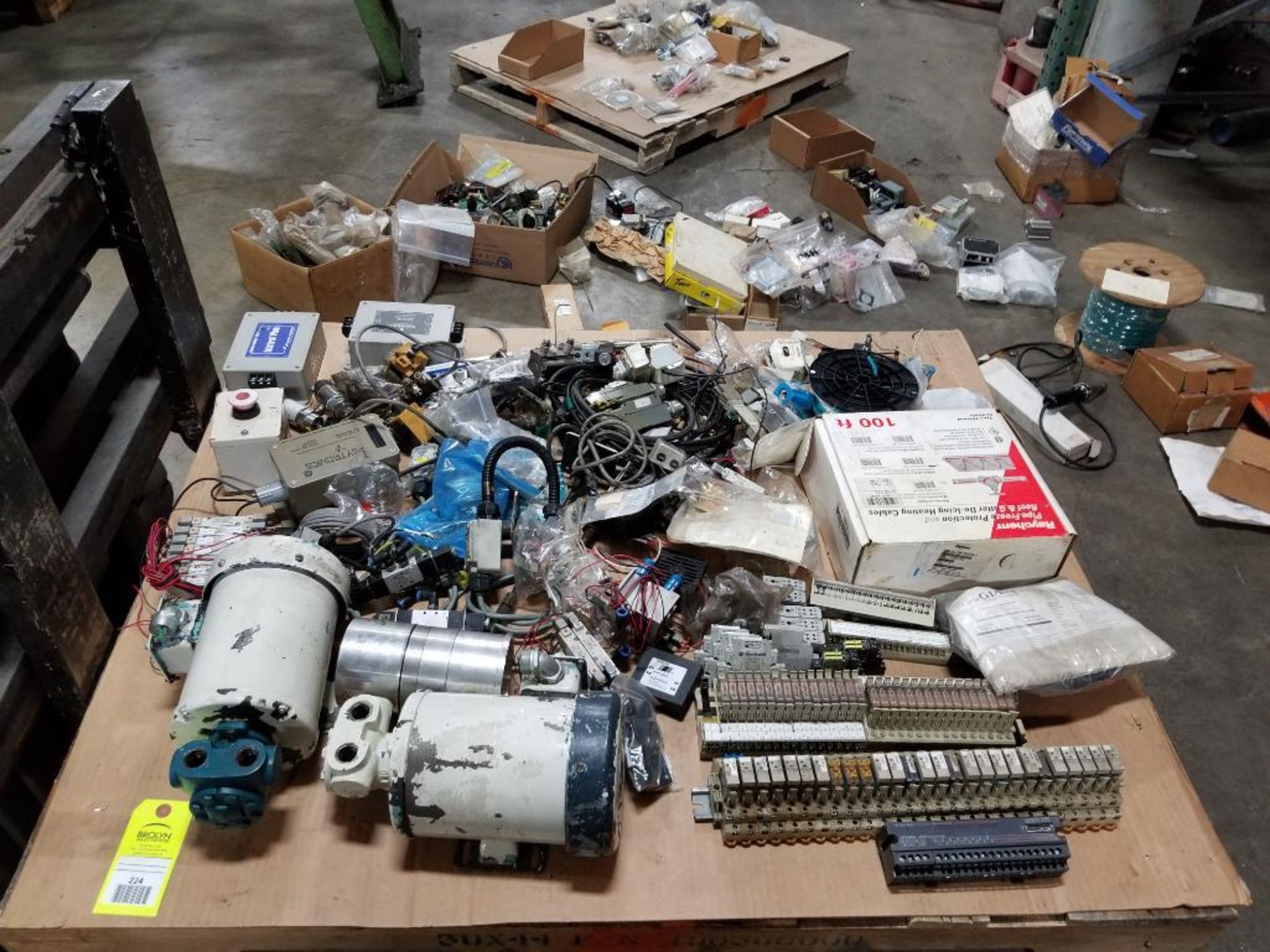Pallet of assorted electrical replacement parts.