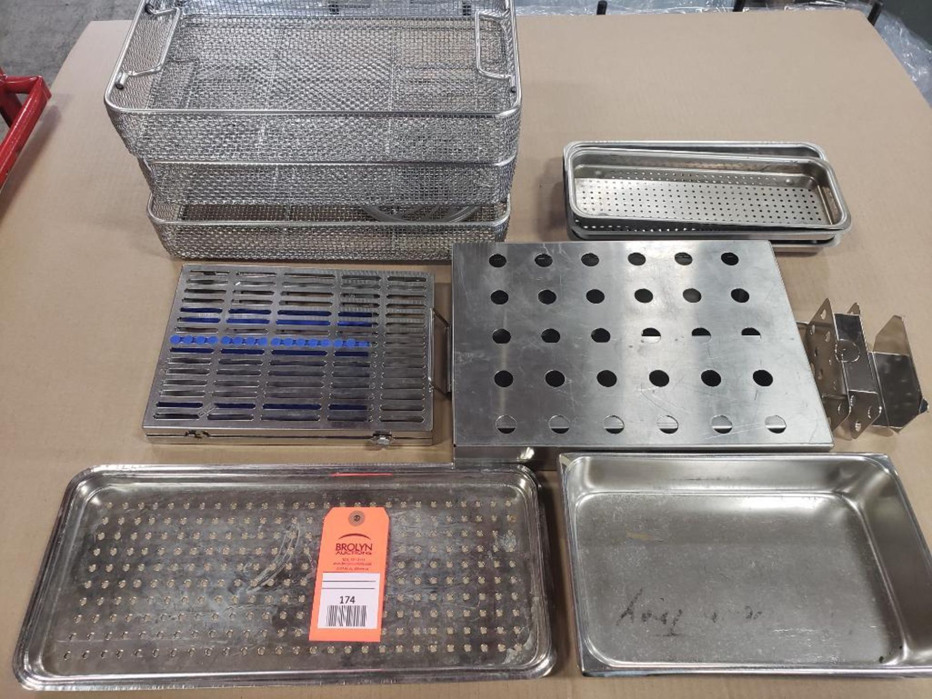 Assorted stainless steel trays and baskets.