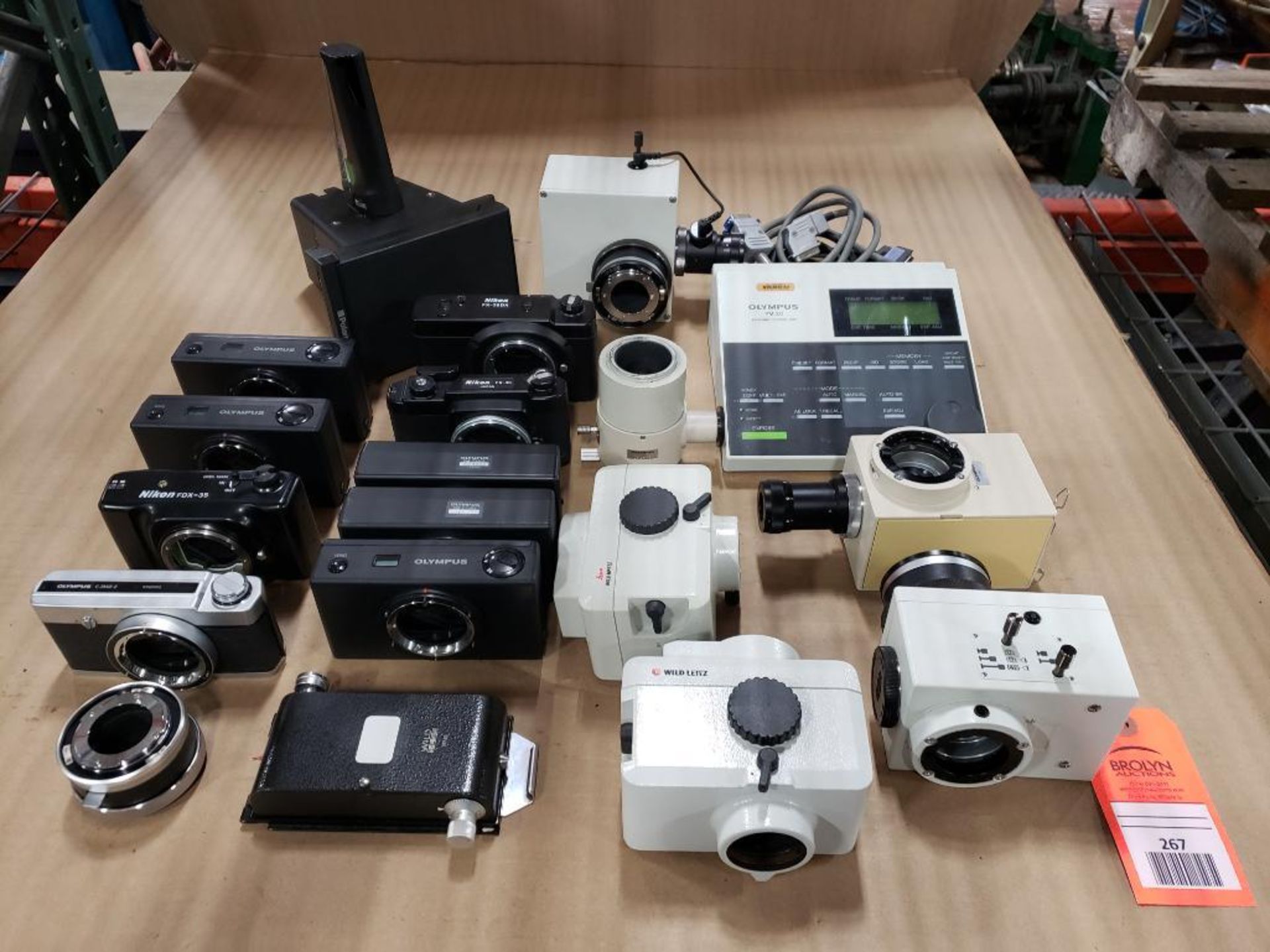Assorted microscope cameras and accessories equipment.