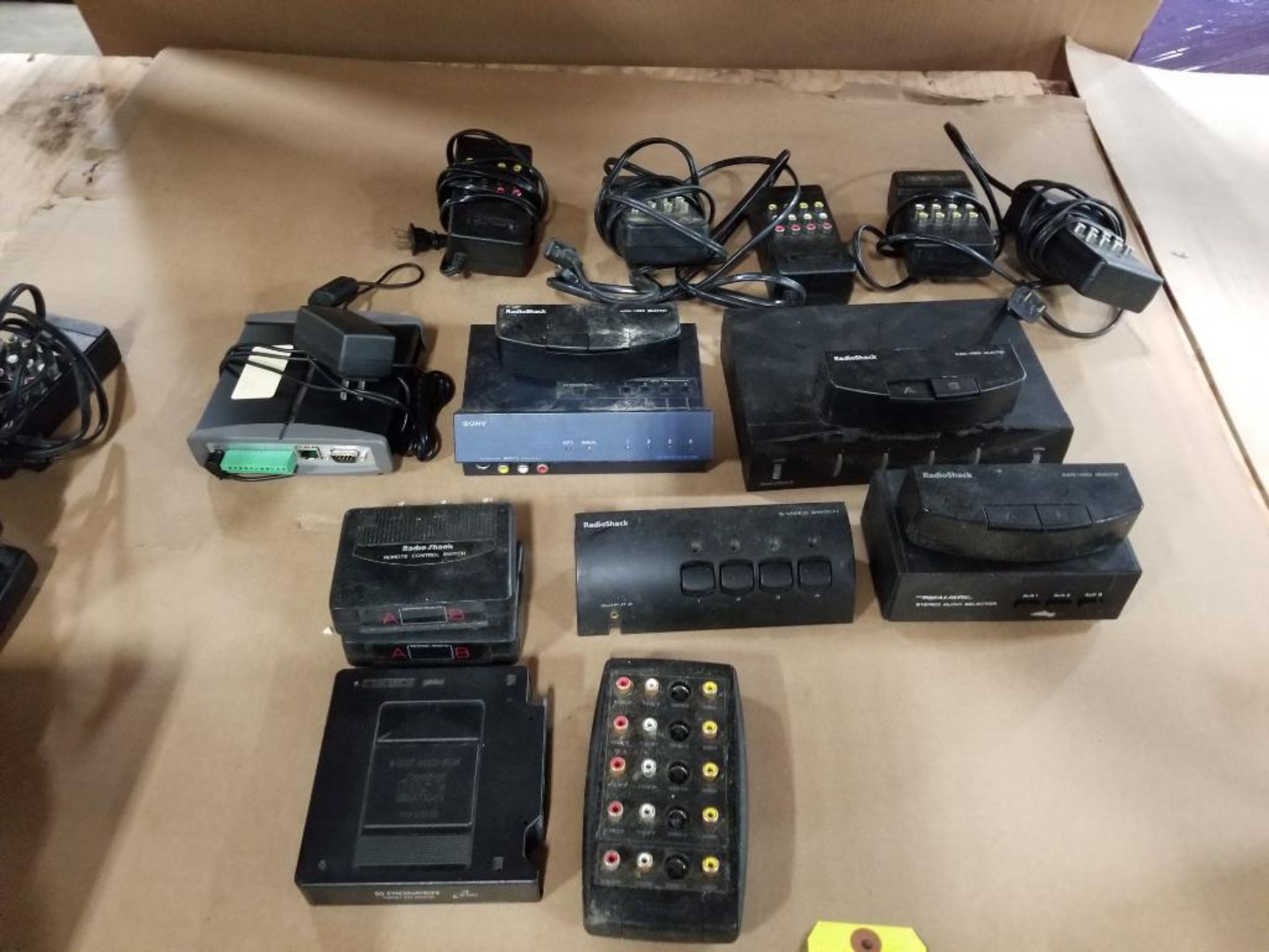 Assorted electrical audio switch equipment. RadioShack, Sony, Pioneer.