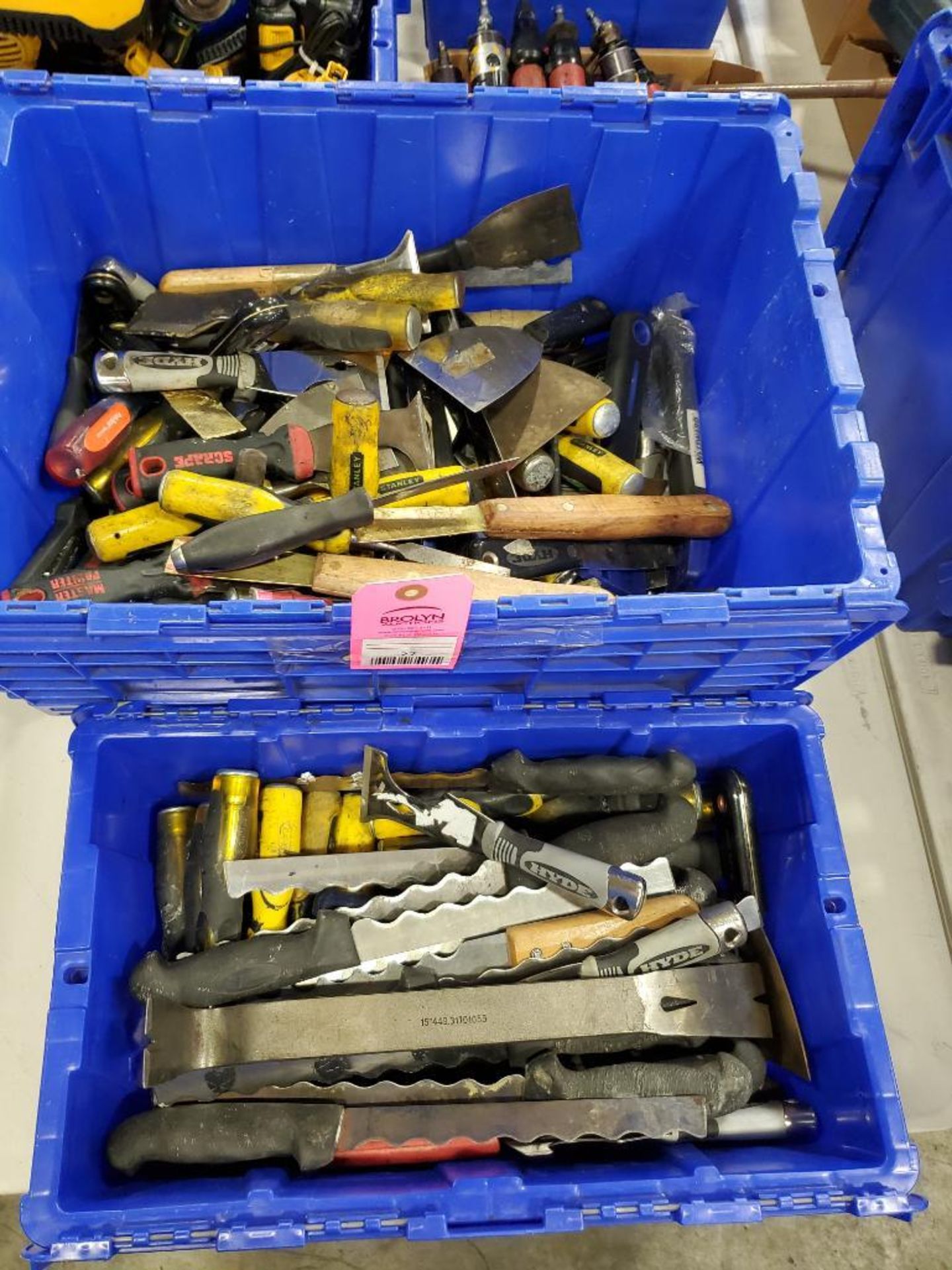 Assorted hand tools. Putty knifes / scrappers, cutters, breakers.