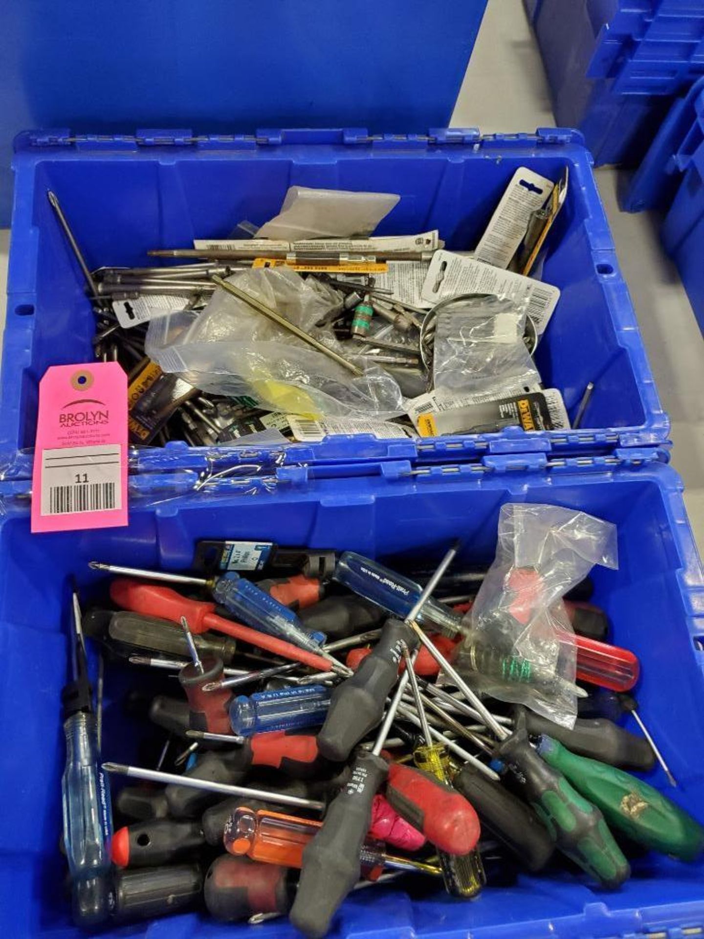 Assorted hand tools and power tool accessories. Drill extensions, sockets, screwdrivers.