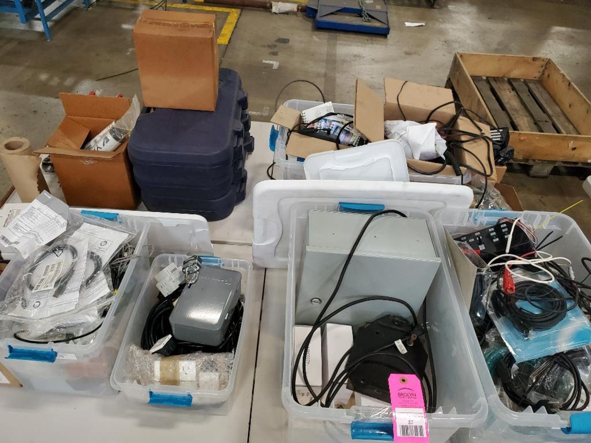 Assorted electrical power supply, cords, chargers, hand tool cutter, hand held scanners.