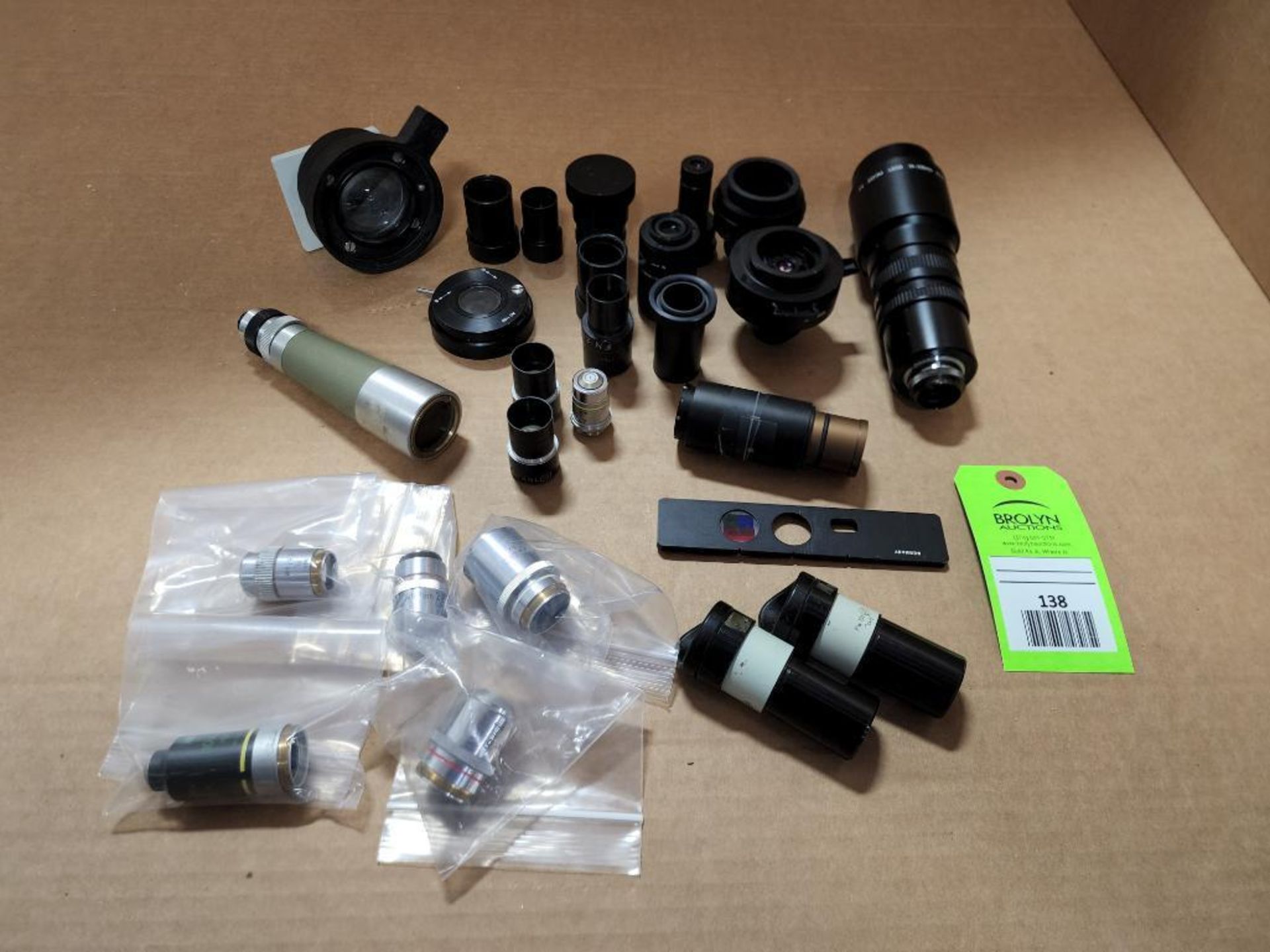 Assorted microscope optics equipment.