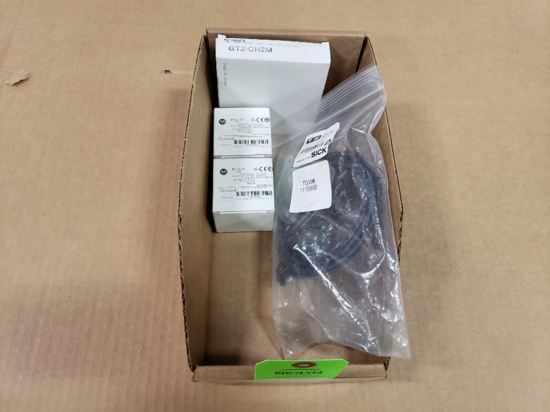 Assorted Keyence, Allen Bradley, and Sick parts. New in package.