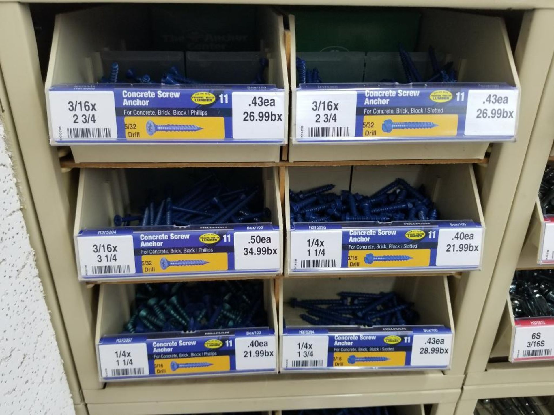 Full column section of bolt fastener display with bins, contents in bins and on top. - Image 9 of 11