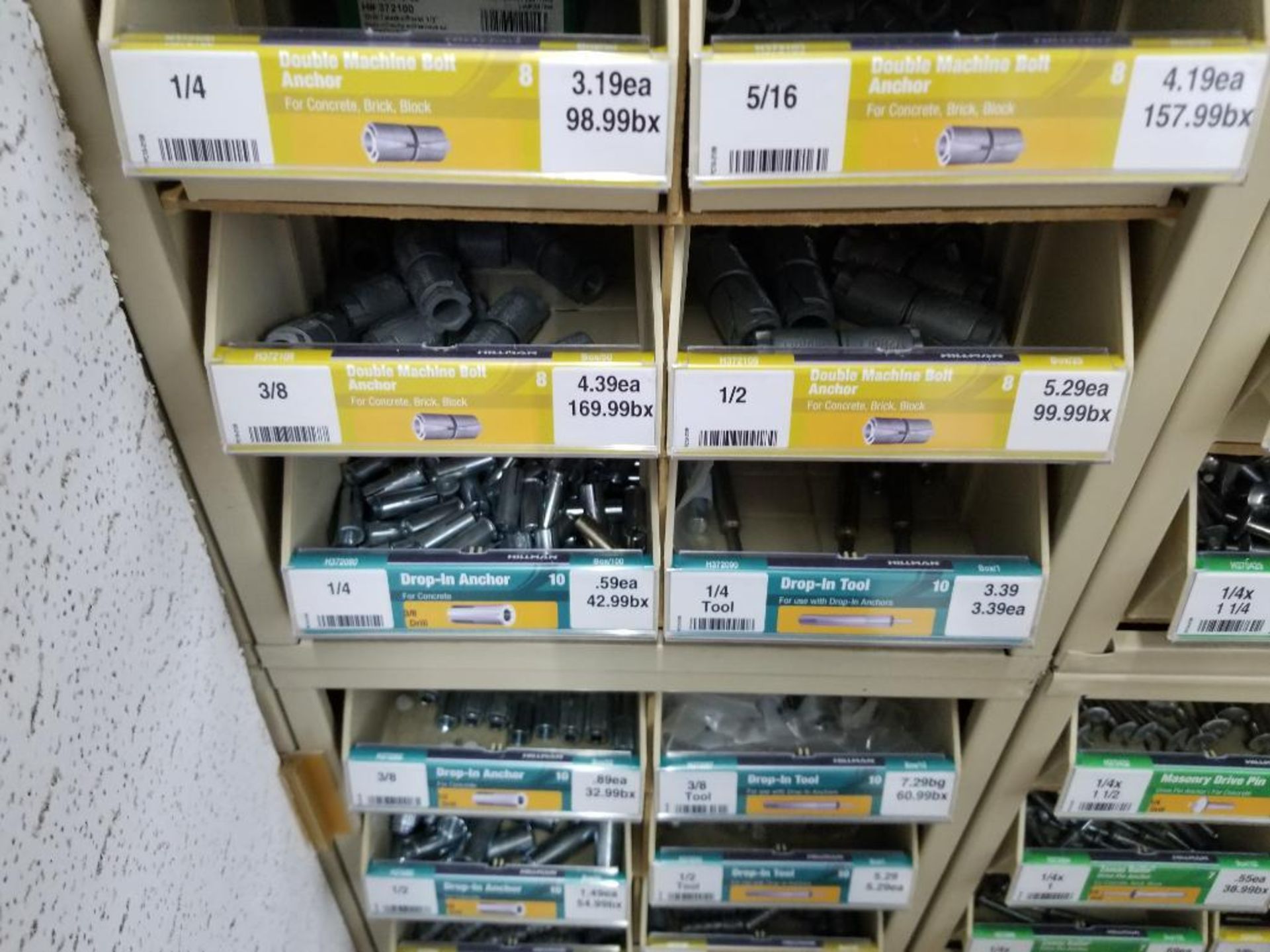 Full column section of bolt fastener display with bins, contents in bins and on top. - Image 15 of 16