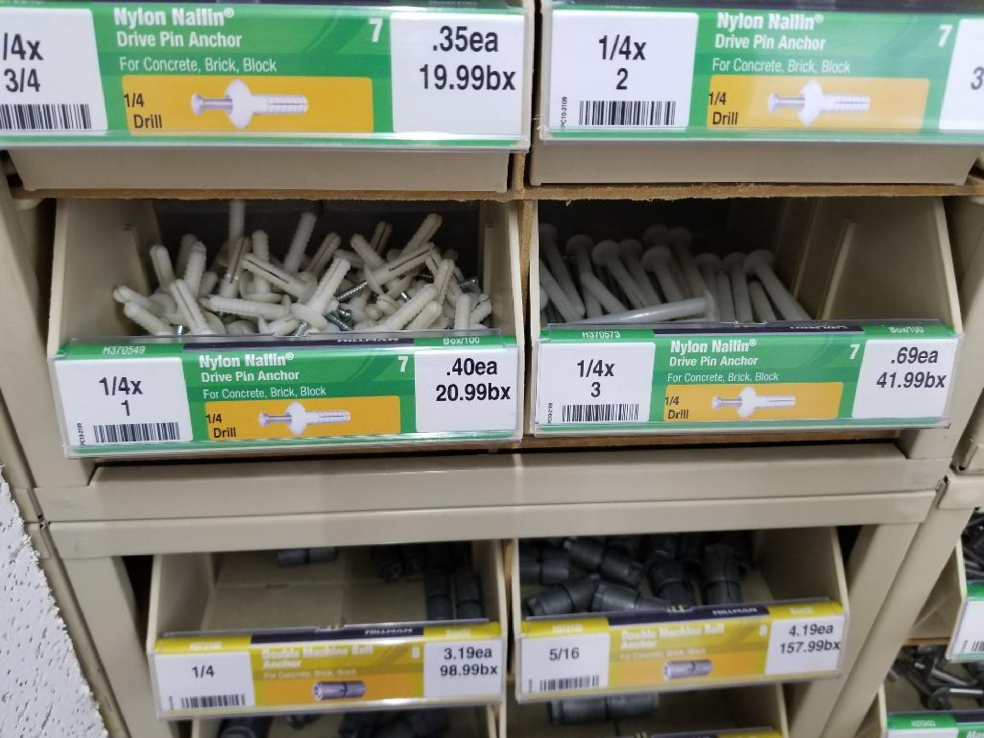 Full column section of bolt fastener display with bins, contents in bins and on top. - Image 9 of 16