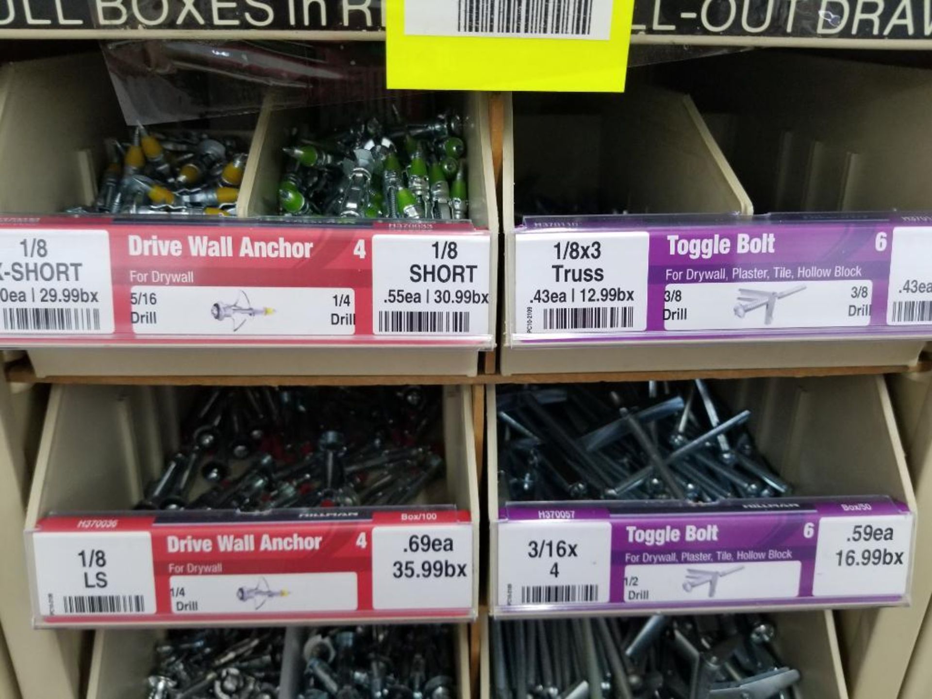 Full column section of bolt fastener display with bins, contents in bins and on top. - Image 7 of 13