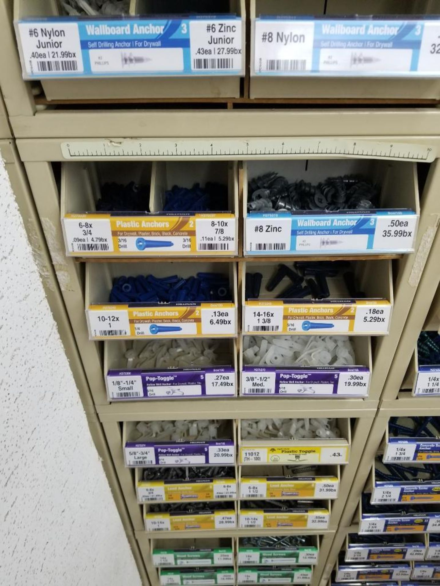 Full column section of bolt fastener display with bins, contents in bins and on top. - Image 2 of 12