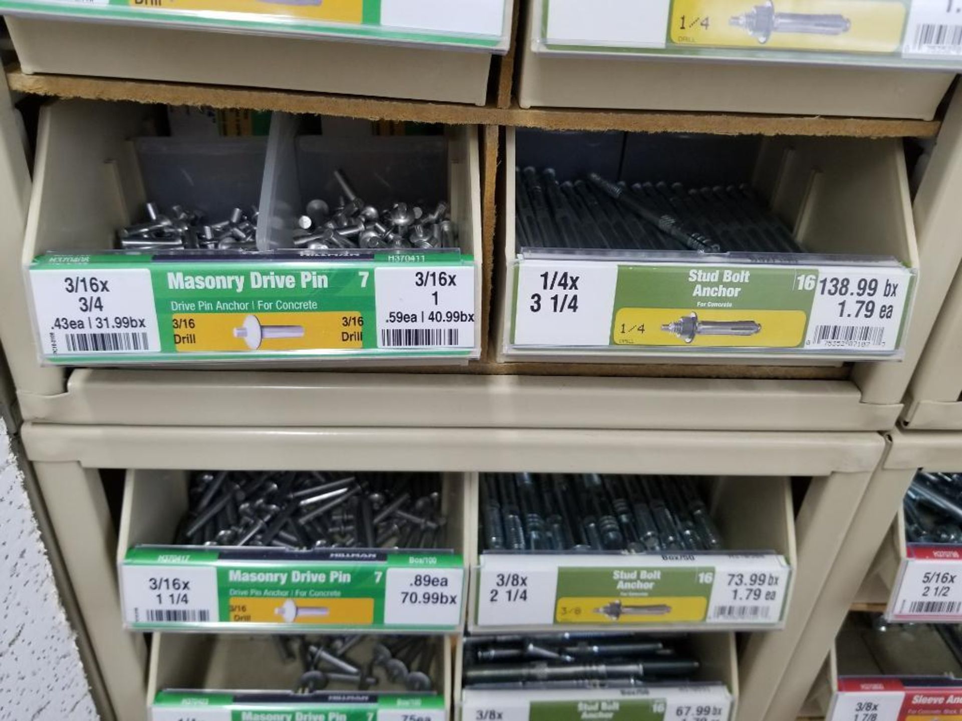 Full column section of bolt fastener display with bins, contents in bins and on top. - Image 8 of 12
