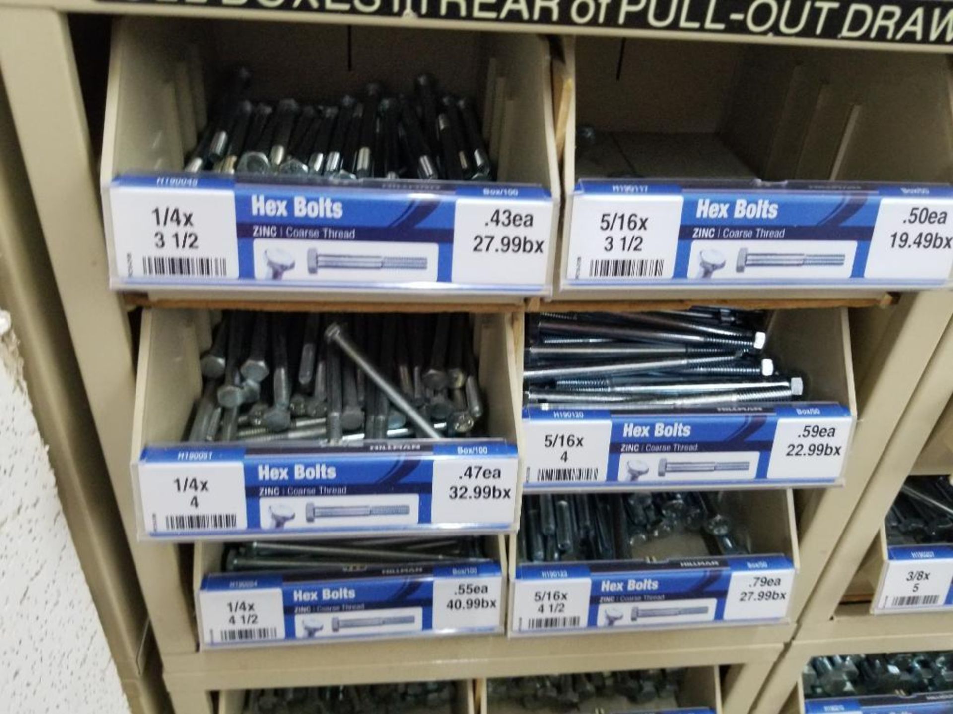 Full column section of bolt fastener display with bins, contents in bins and on top. - Image 9 of 10