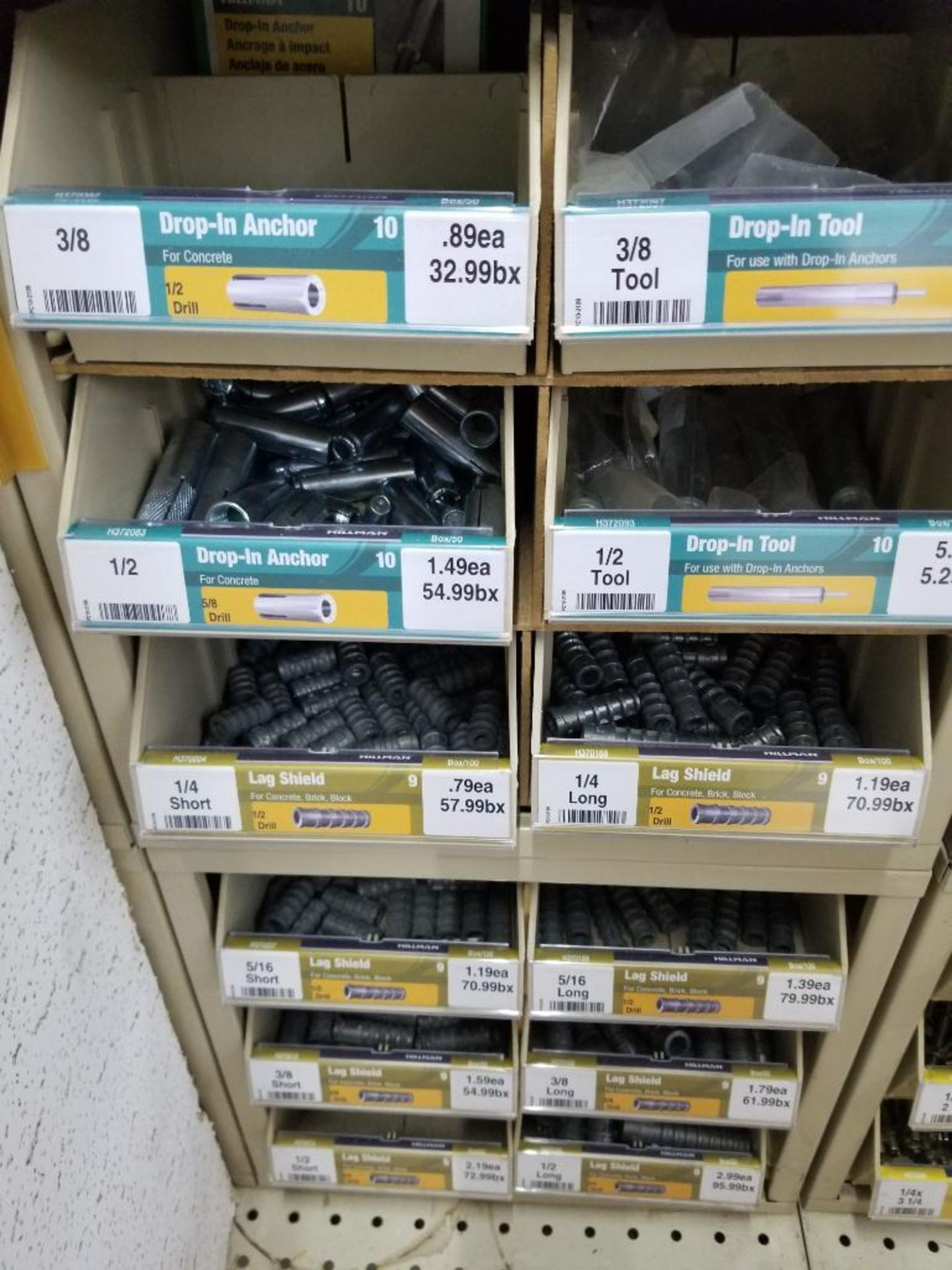 Full column section of bolt fastener display with bins, contents in bins and on top. - Image 11 of 16