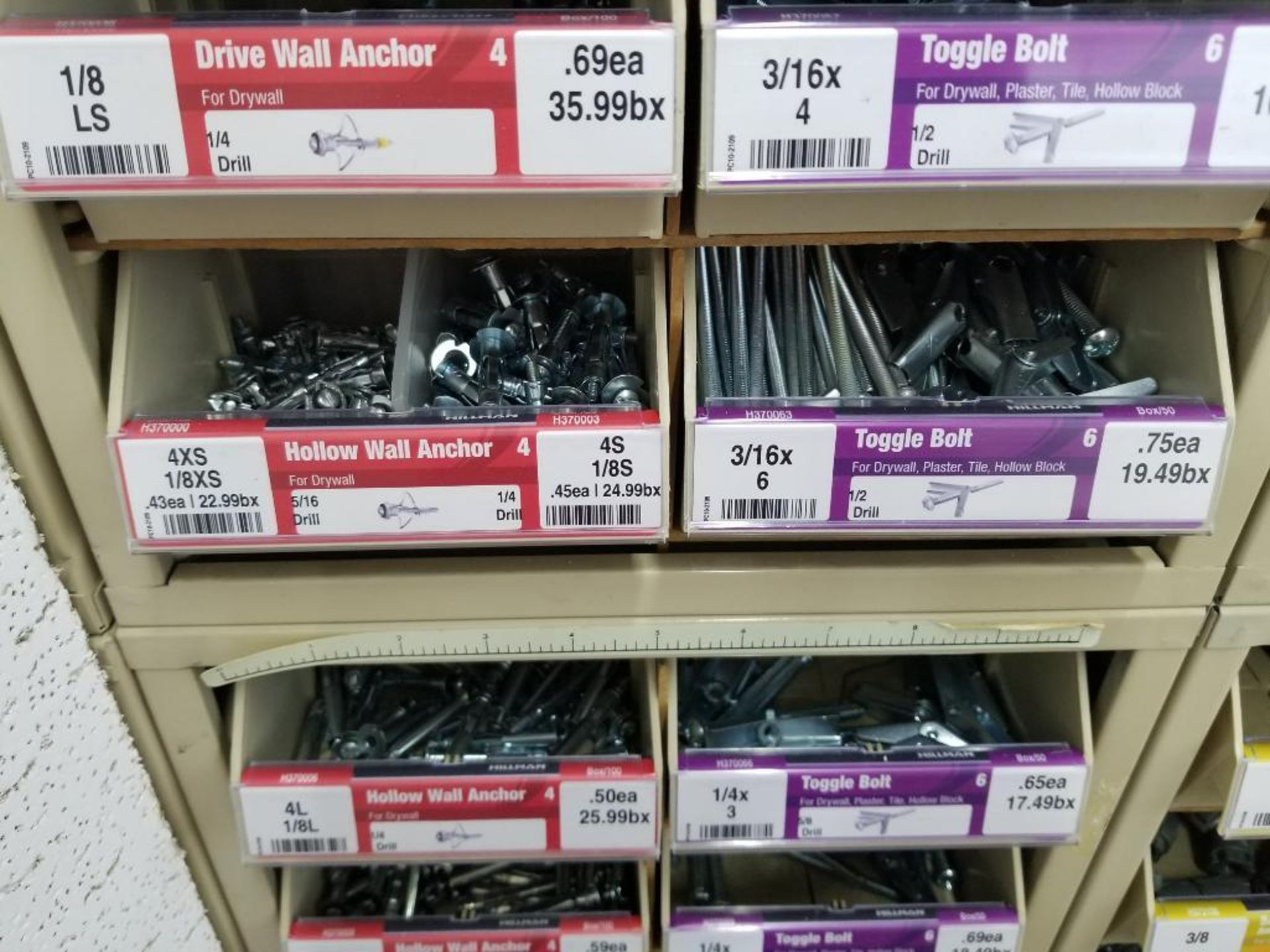 Full column section of bolt fastener display with bins, contents in bins and on top. - Image 8 of 13