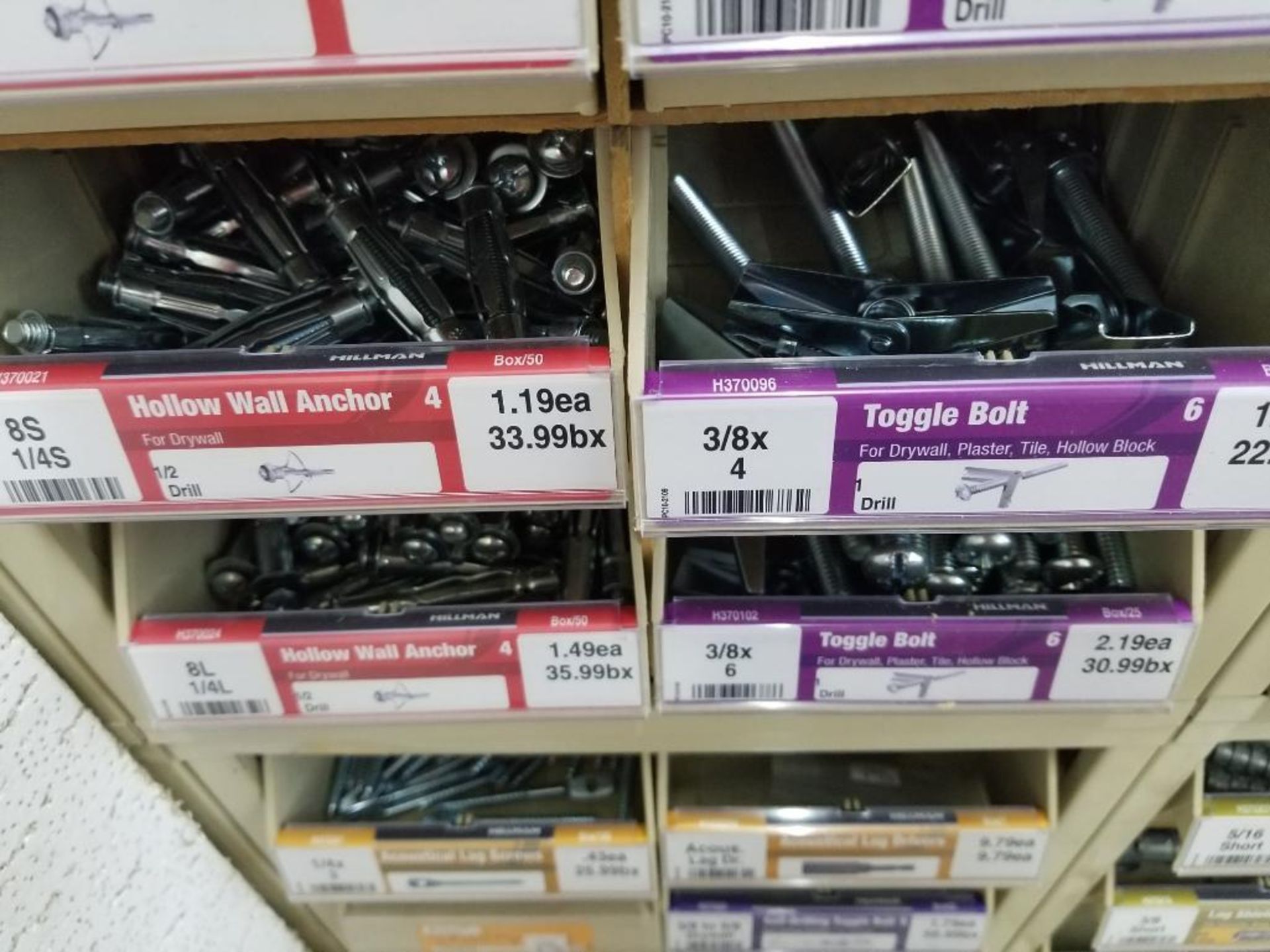 Full column section of bolt fastener display with bins, contents in bins and on top. - Image 11 of 13