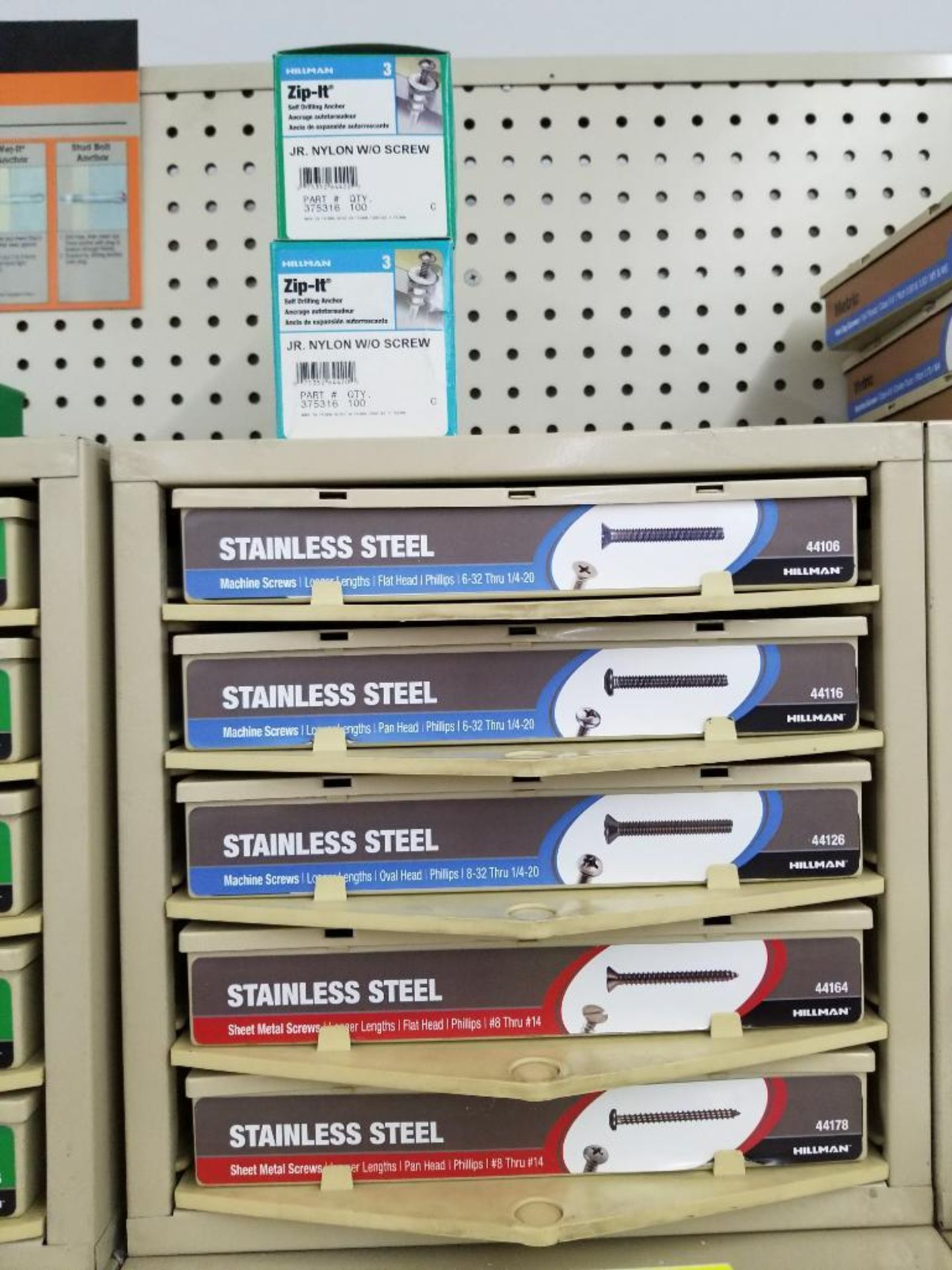 Full column section of bolt fastener display with bins, contents in bins and on top. - Image 4 of 12